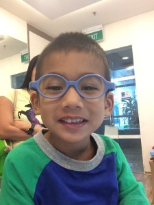 Trying out his new glasses for the first time